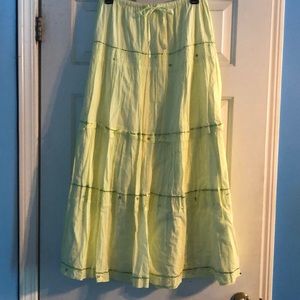 Greenish yellow long skirt.